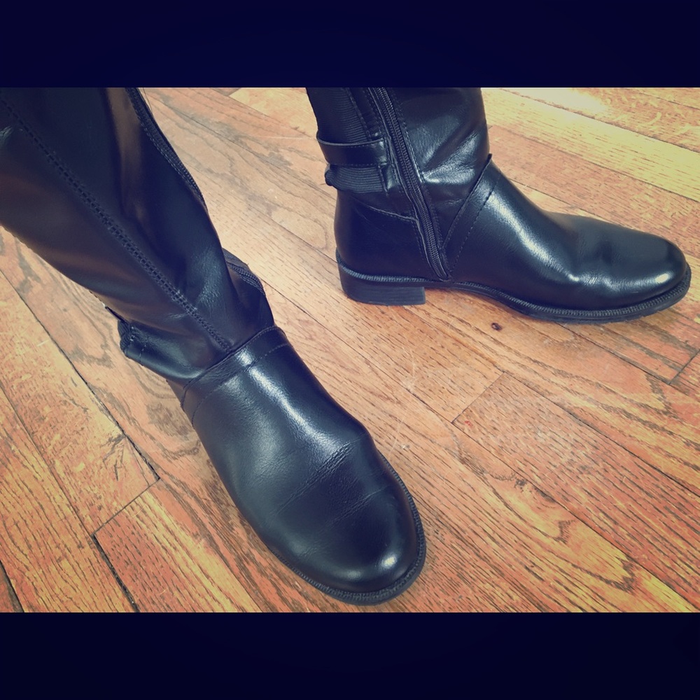 Aerosols- Black knee-high, wise-calf riding boots.